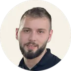 Bruno Molan, the designer behind Tour to Aisle, smiling in a black polo